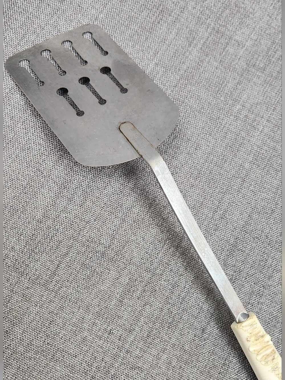 Vintage Ekco Stainless Steel Slotted Spatula White Handle.
